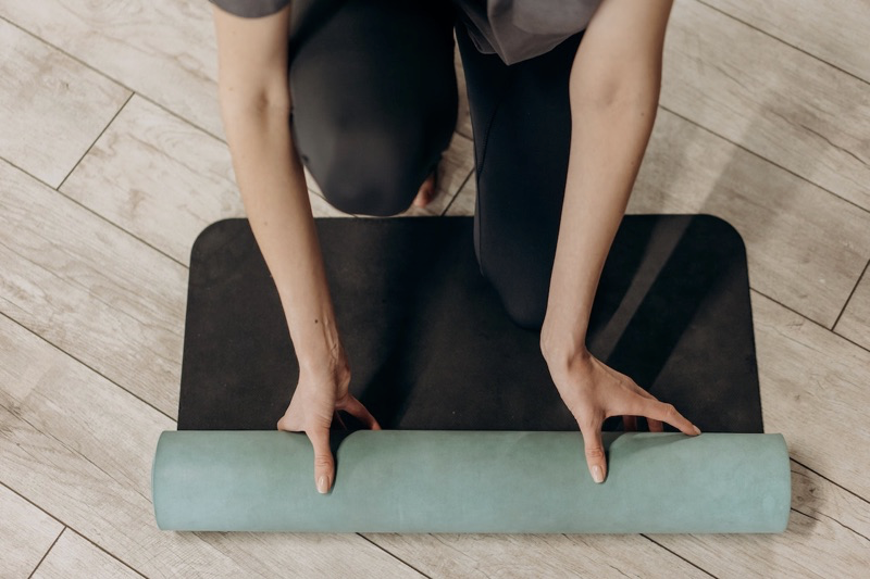 Unrolling yoga mat
